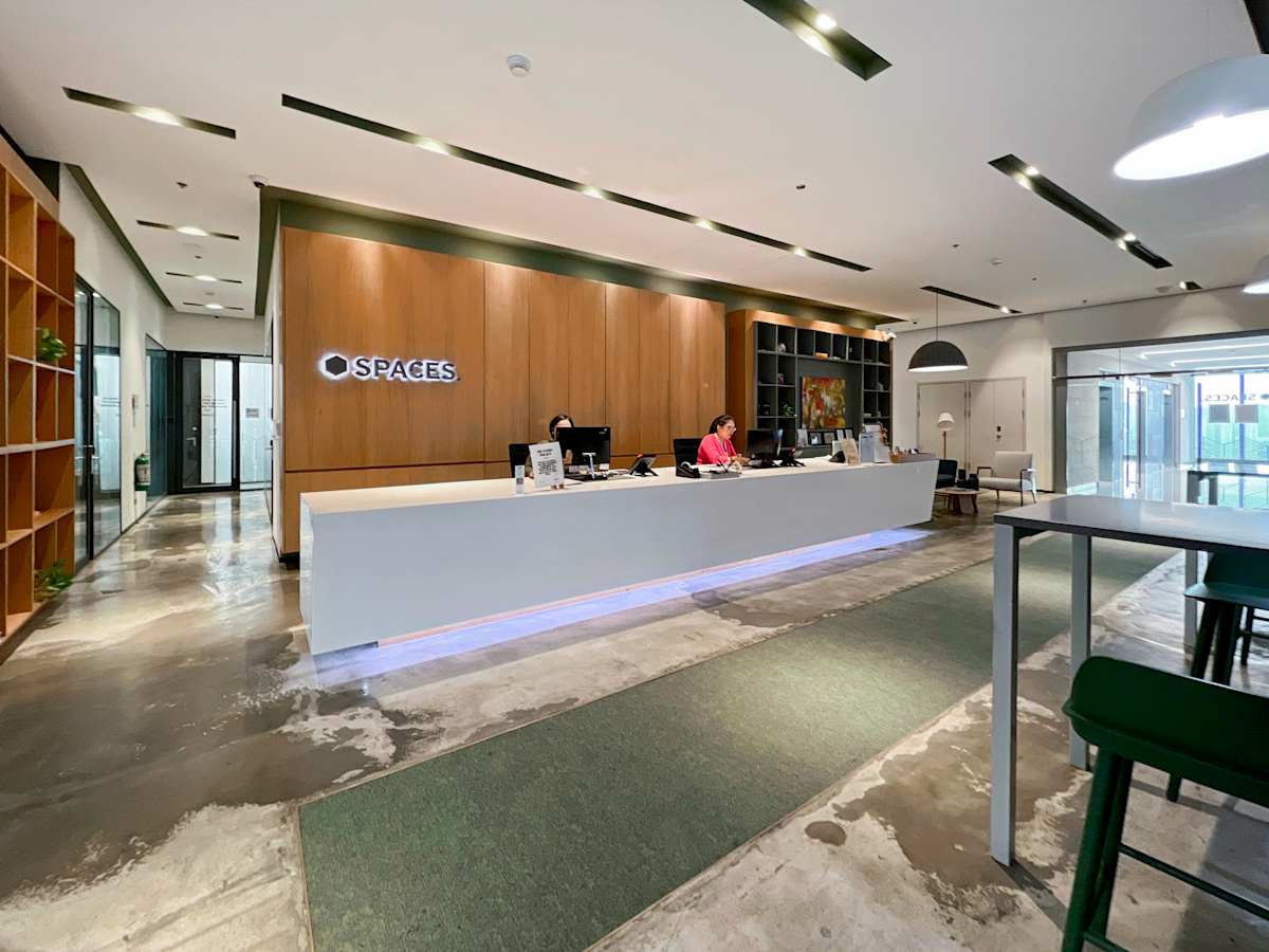 Modern coworking space on 5th Avenue, Metro Manila, featuring a sleek reception area and open layout.