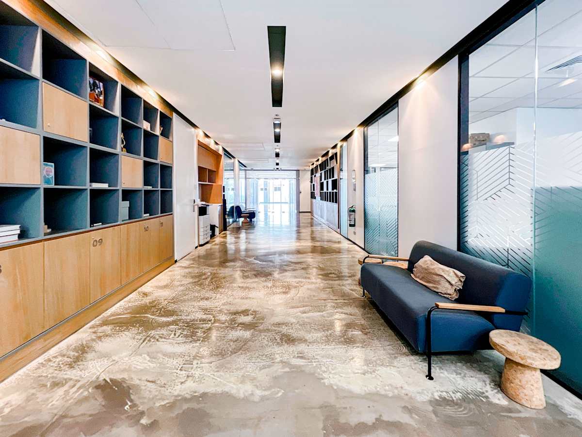 Modern coworking space with sleek seating, ample storage, and natural light on 5th Ave.