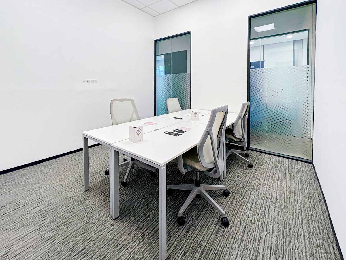 Modern coworking space with sleek desks and ergonomic chairs on 5th Avenue, Metro Manila.