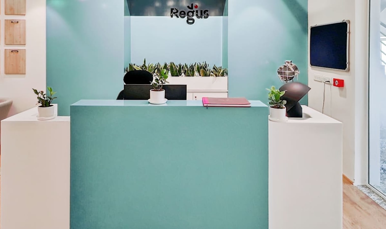 Modern reception area in Noida with sleek design and vibrant accents. Ideal for coworking.