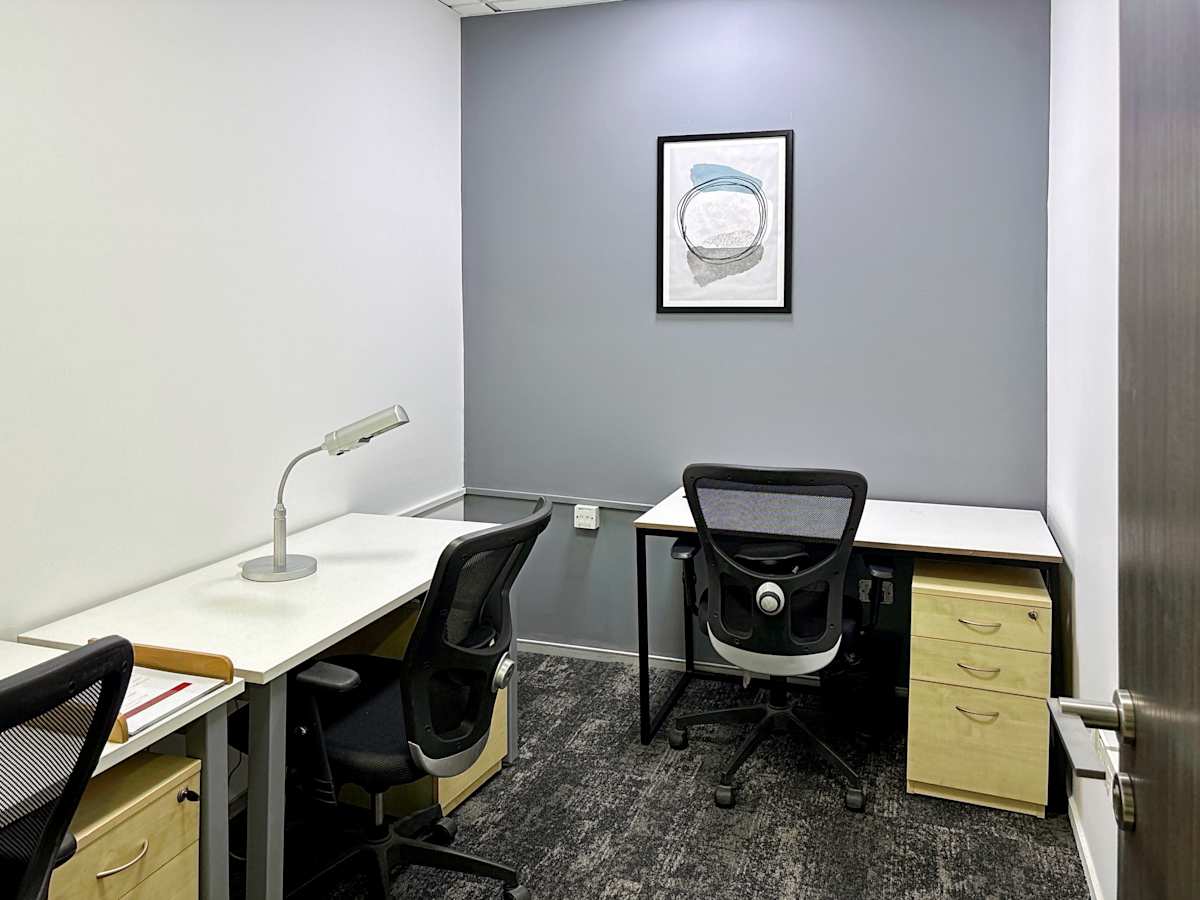 Modern coworking space in Noida featuring ergonomic chairs and ample desk space for productivity.