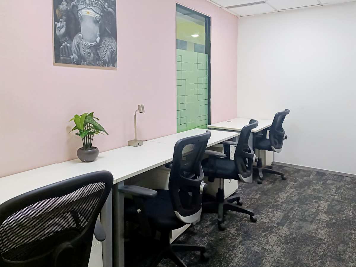Sleek, modern coworking space with ergonomic chairs and vibrant decor in Noida. Ideal for productivity.