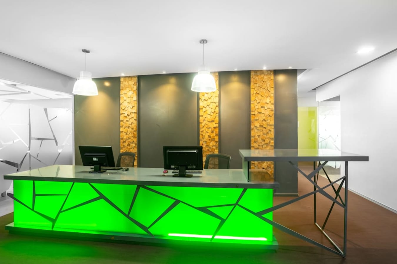 Modern coworking space on Harrington Road, featuring a vibrant reception area and sleek design.