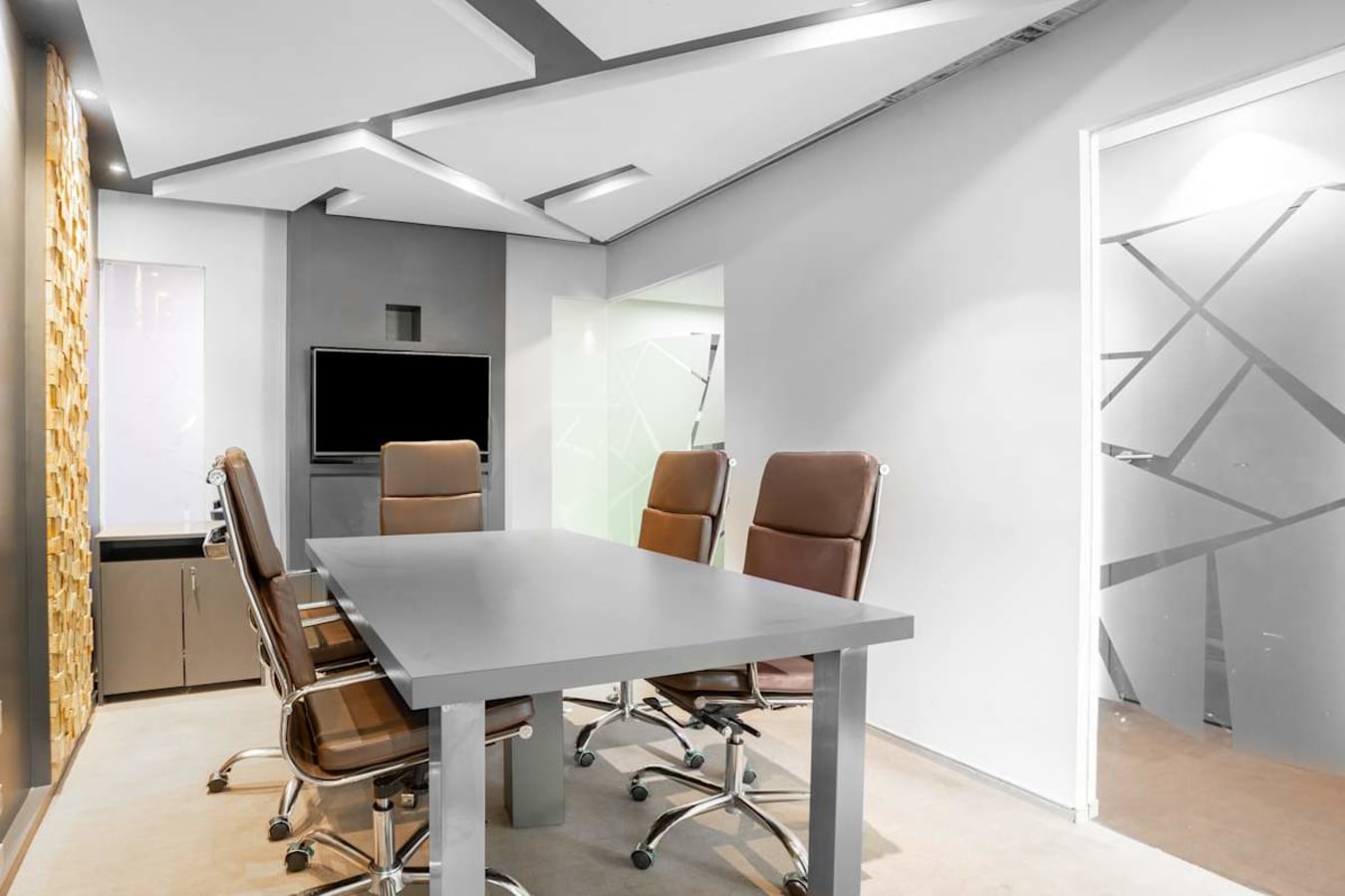 Sleek meeting area with a modern design and ample natural light, ideal for collaboration.