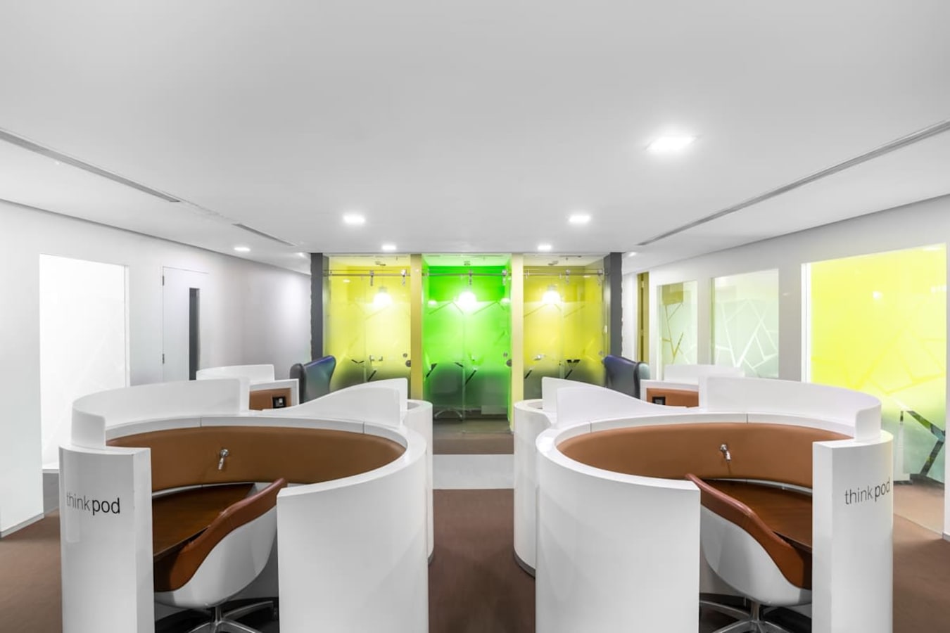 Modern coworking space with sleek pods and bright, colorful accents on Harrington Road.