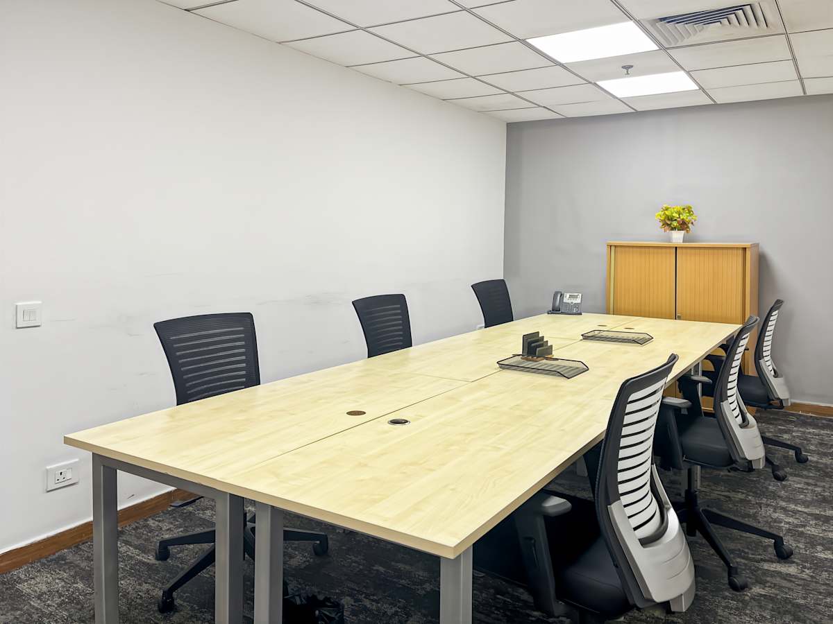 Modern coworking space with ergonomic chairs and a spacious conference table in New Delhi.