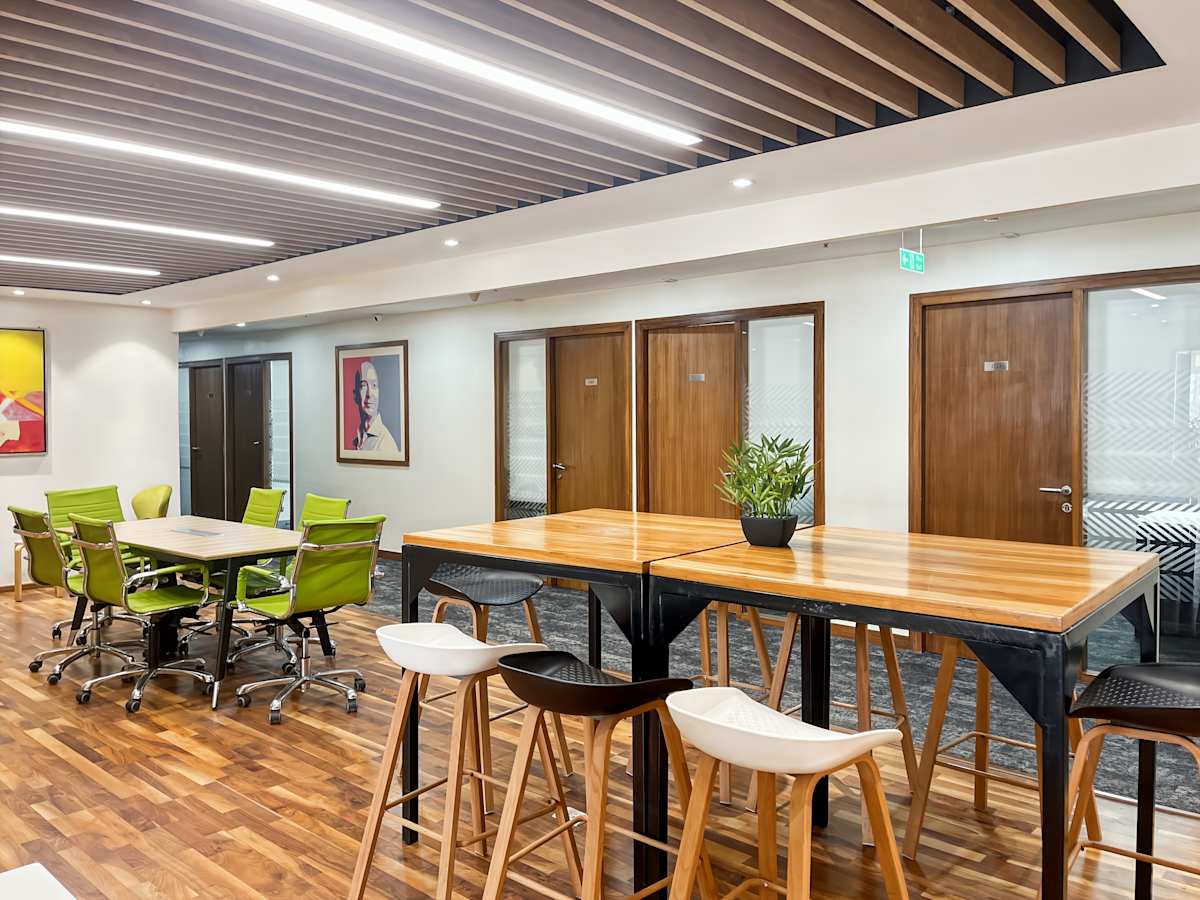 Modern coworking space in New Delhi with vibrant seating and sleek design for collaboration.