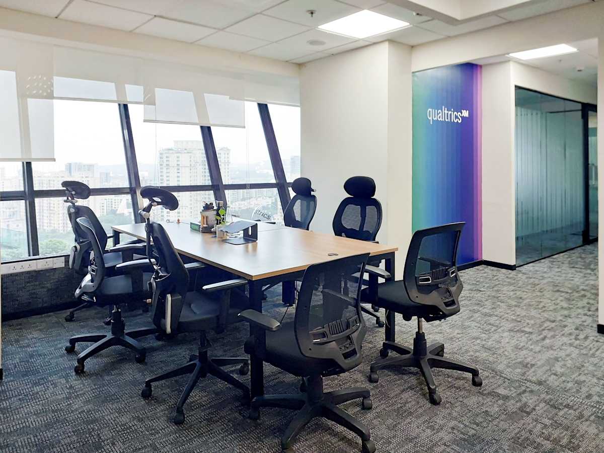 Bright coworking space with modern seating and city views in Mumbai. Ideal for dynamic teams.