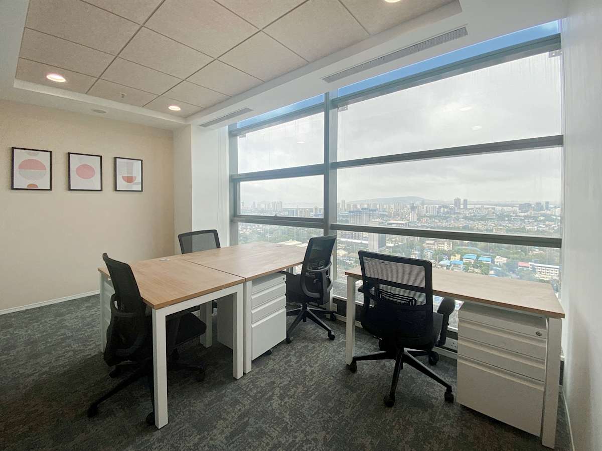 Modern coworking space with city views and ergonomic seating on Turbhe Midc Road, Maharashtra.
