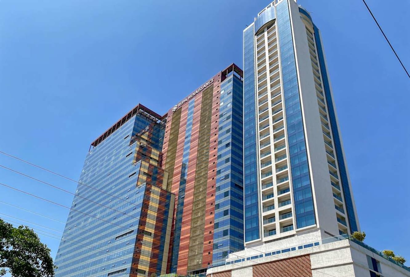 Modern coworking space in a sleek high-rise on Turbhe Midc Road, Maharashtra.