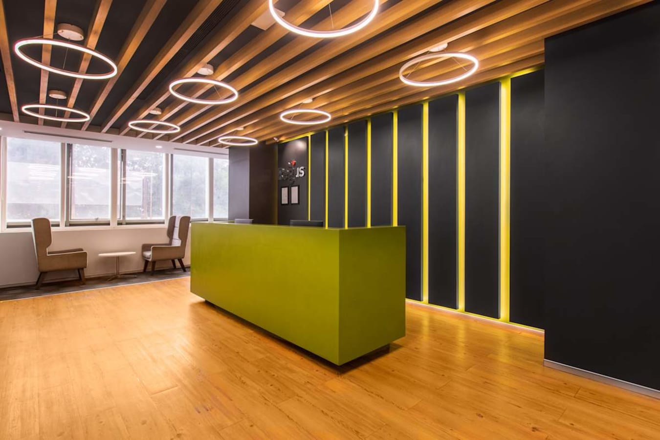 Modern coworking space with sleek design, vibrant lighting, and ample natural light.