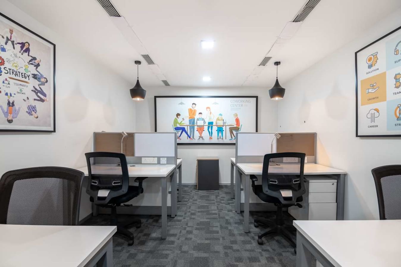 Modern coworking space with sleek desks, ergonomic chairs, and motivational artwork.