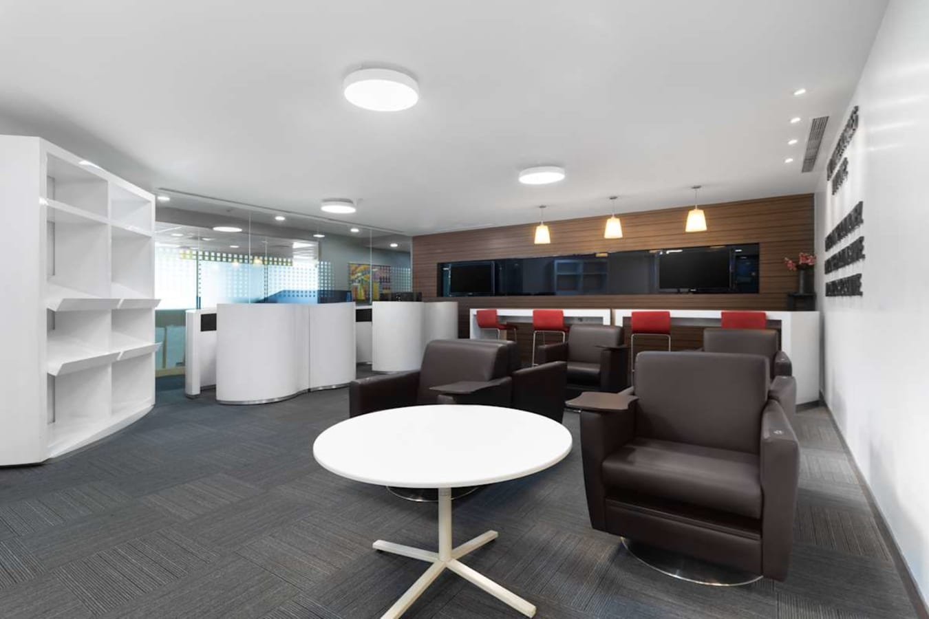 Modern coworking space with sleek furnishings and ample natural light, ideal for collaboration.
