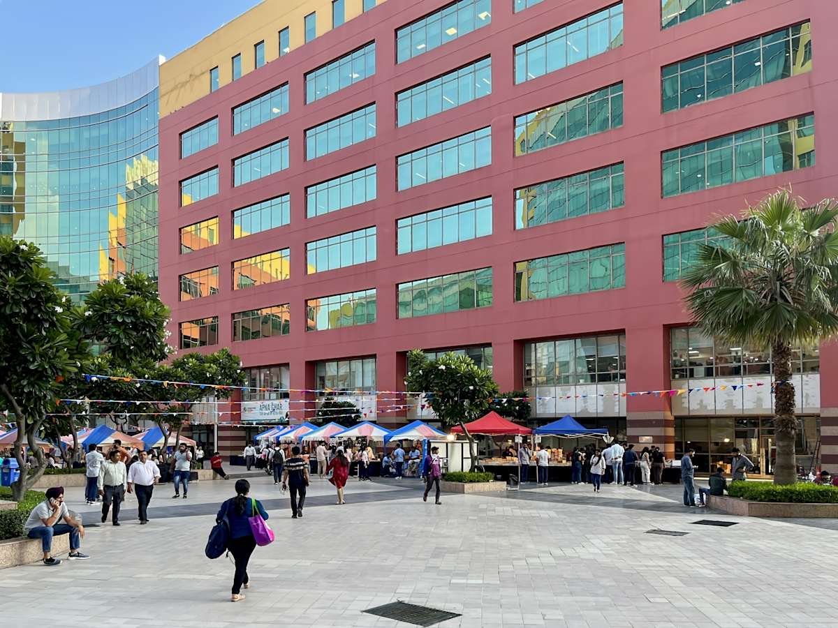 Vibrant coworking hub in Gurugram featuring modern architecture and a lively outdoor space.