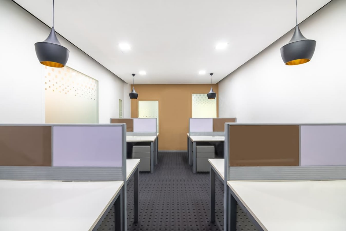 Modern coworking space with stylish lighting and spacious workstations on Doctor Annie Besant Road.