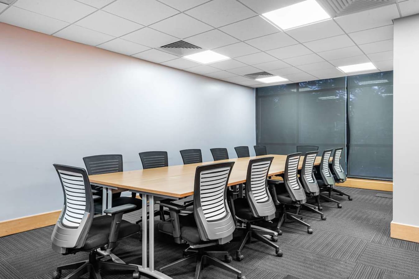 Modern conference room with ample seating and natural light at a flexible coworking space in Banjara Hills.