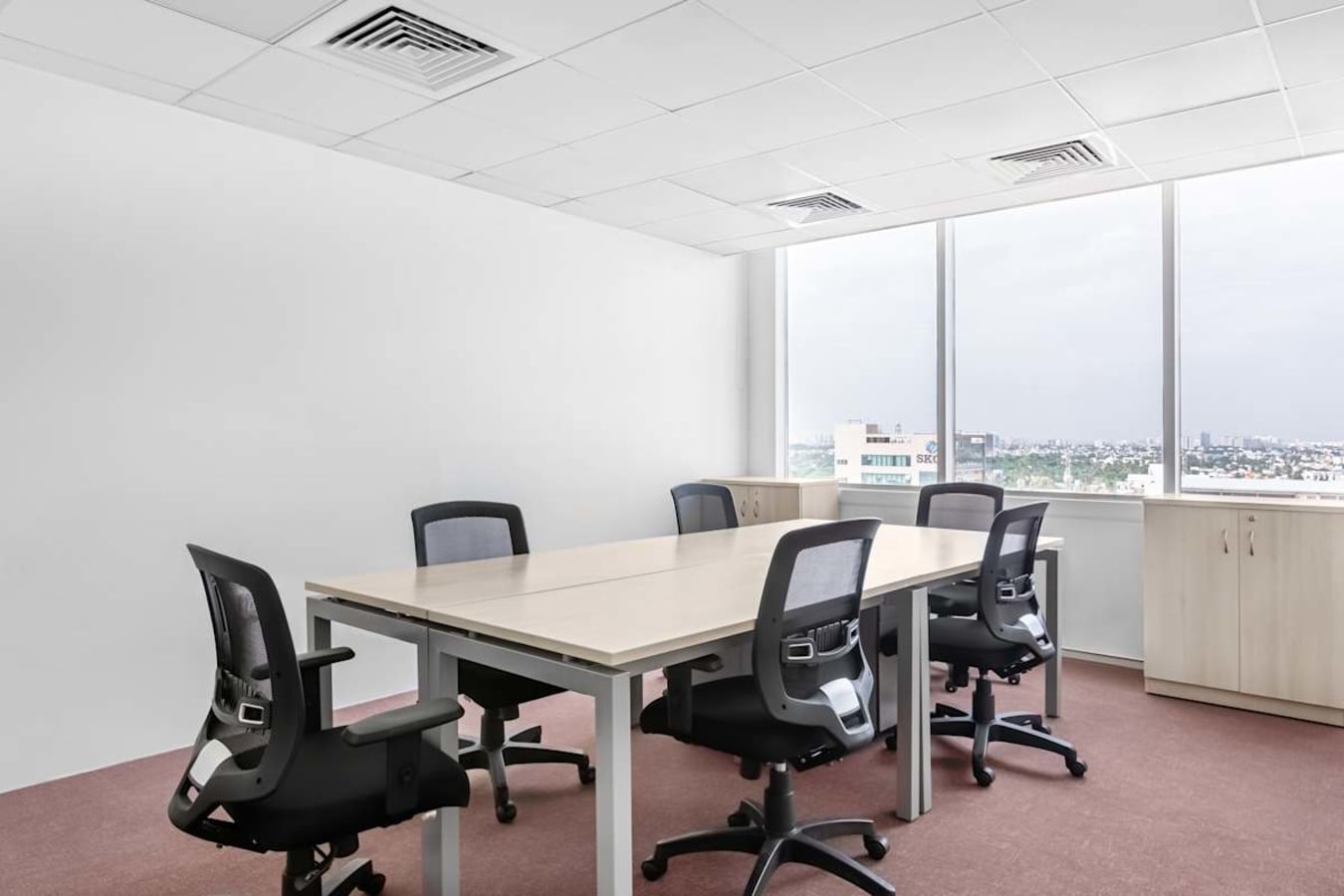 Modern coworking space with natural light and ergonomic seating in South Phase, Tamil Nadu.