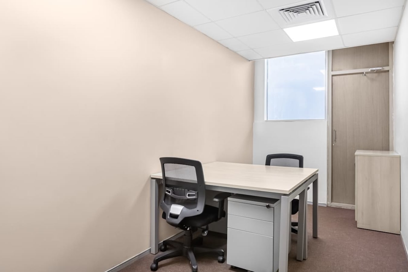 Modern coworking space with sleek furnishings and abundant natural light in South Phase.