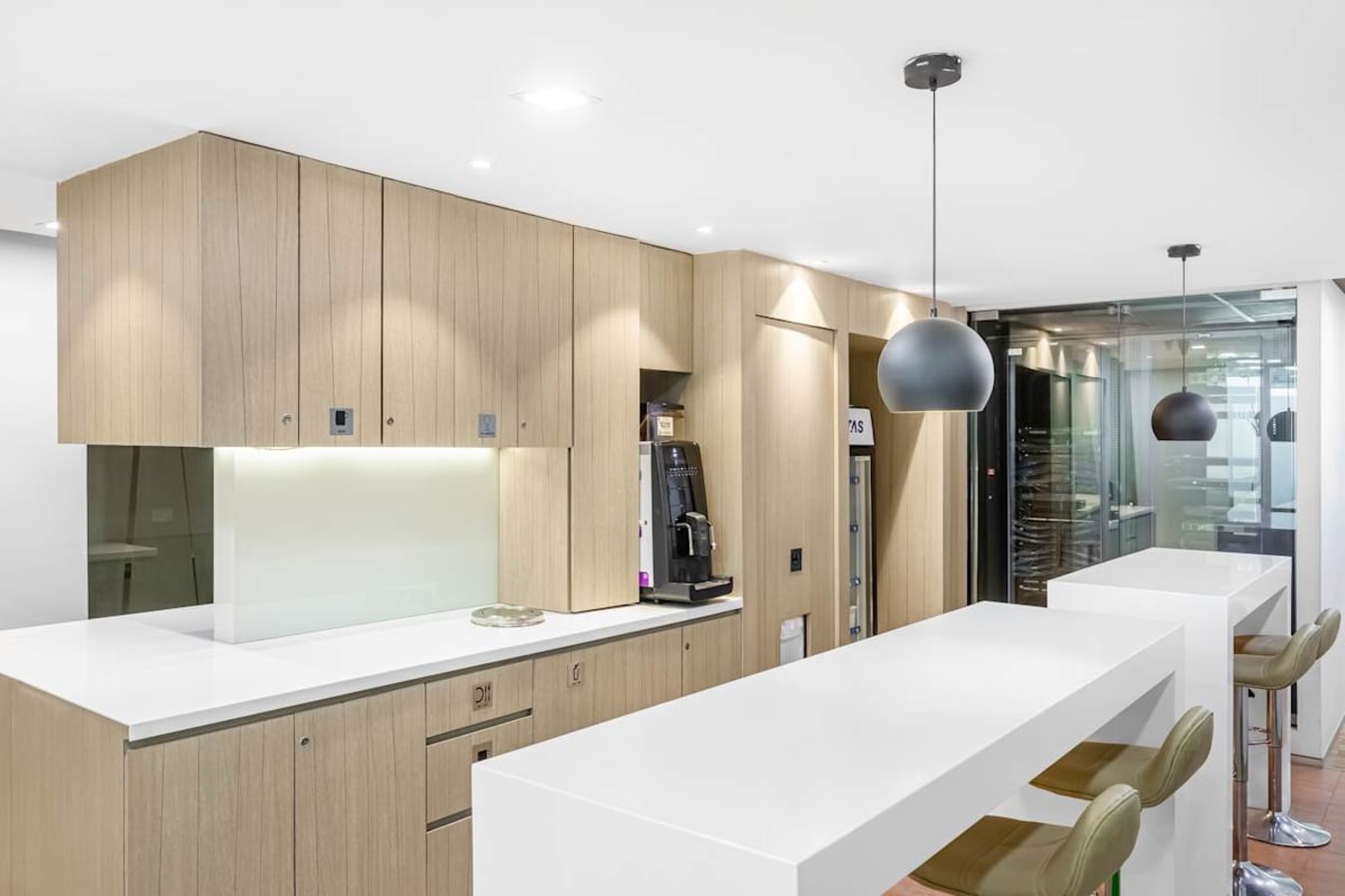Sleek coworking kitchen area with modern counters and ample seating in South Phase, Tamil Nadu.