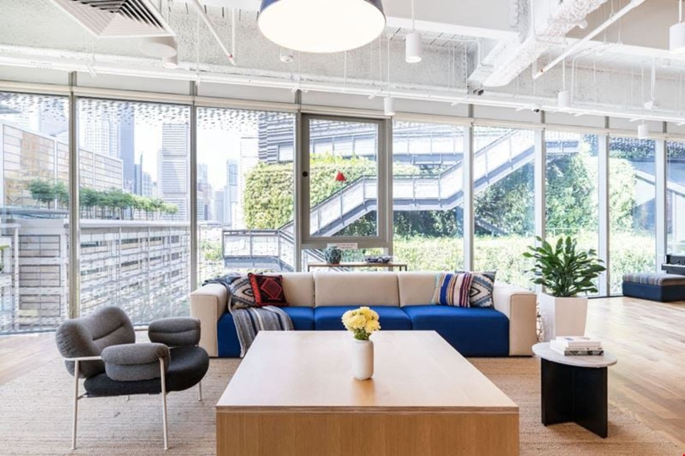 Bright coworking space with modern seating and floor-to-ceiling windows on North Bridge Road.