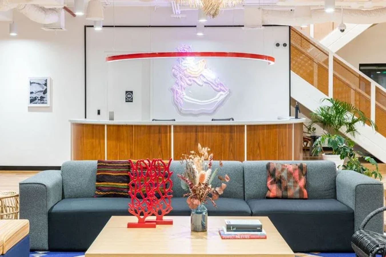Vibrant coworking space with modern decor on Ayala Avenue, featuring a cozy seating area and stylish accents.