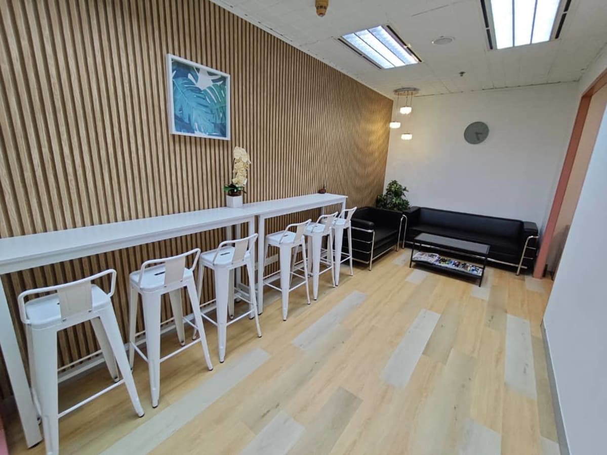 Sleek coworking area with stylish seating, natural light, and modern decor in Jalan Pinang.