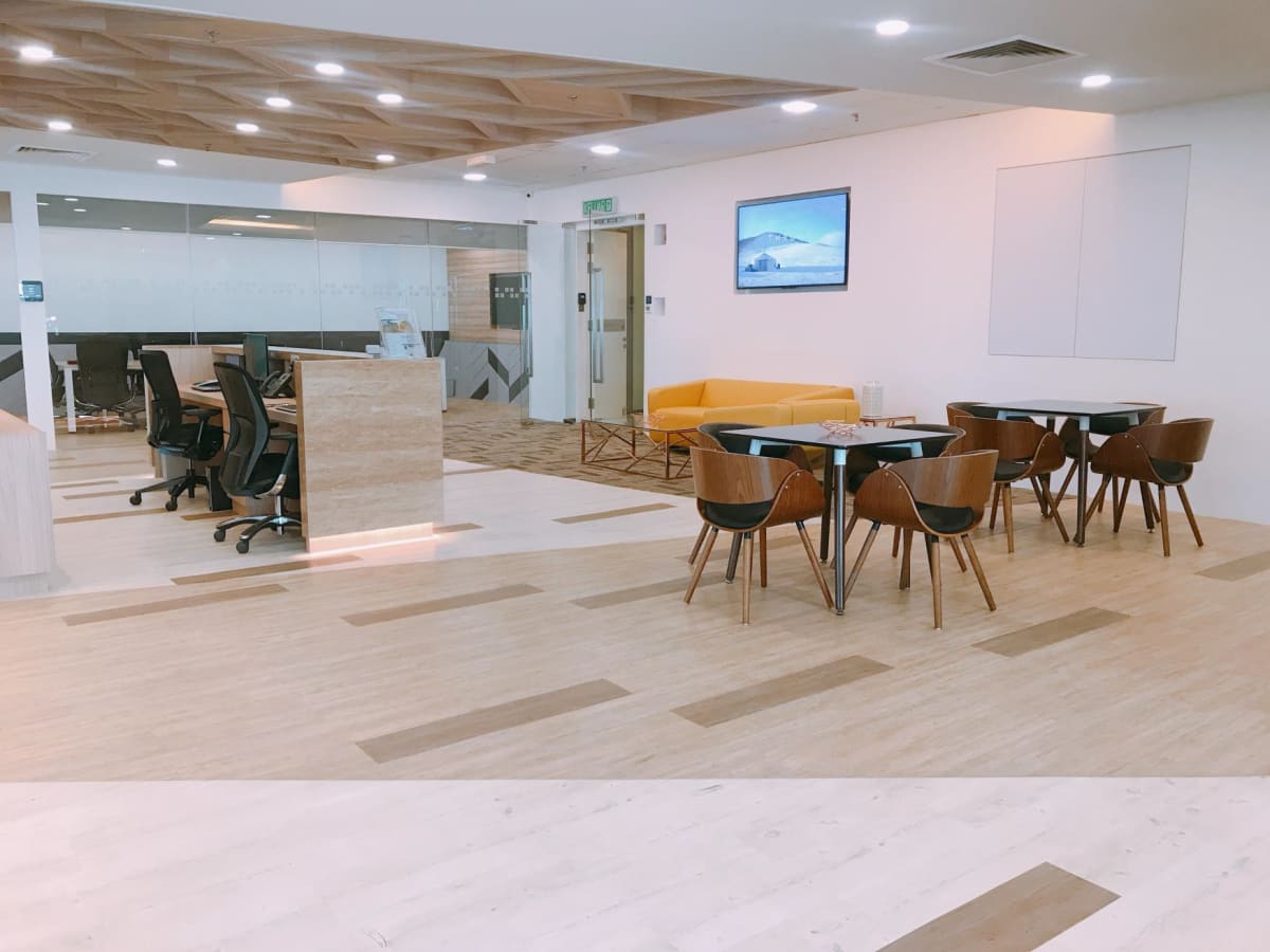 Modern coworking space in Selangor with versatile seating and sleek, welcoming design.