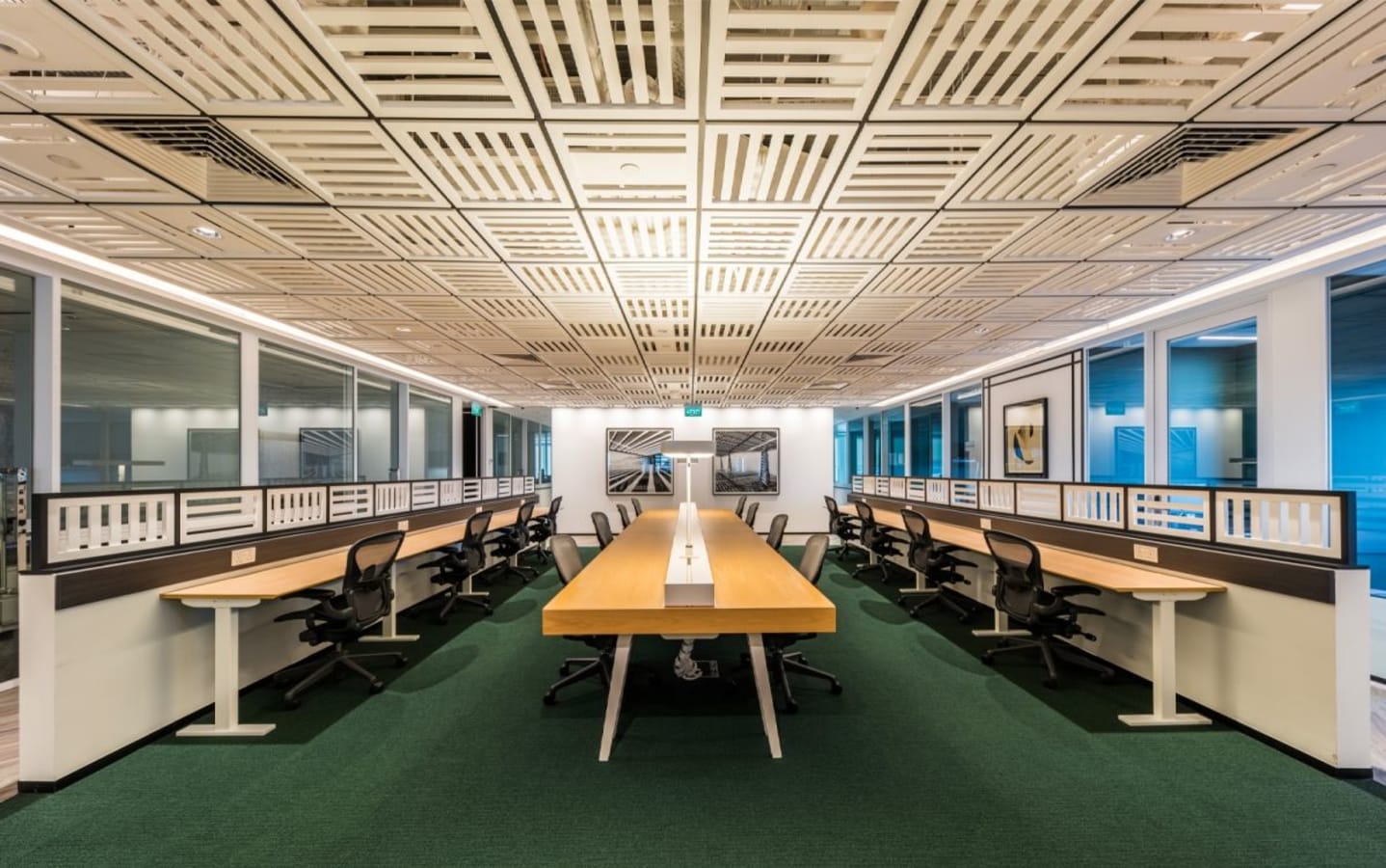 Modern coworking space with ample seating and natural light, ideal for collaboration.