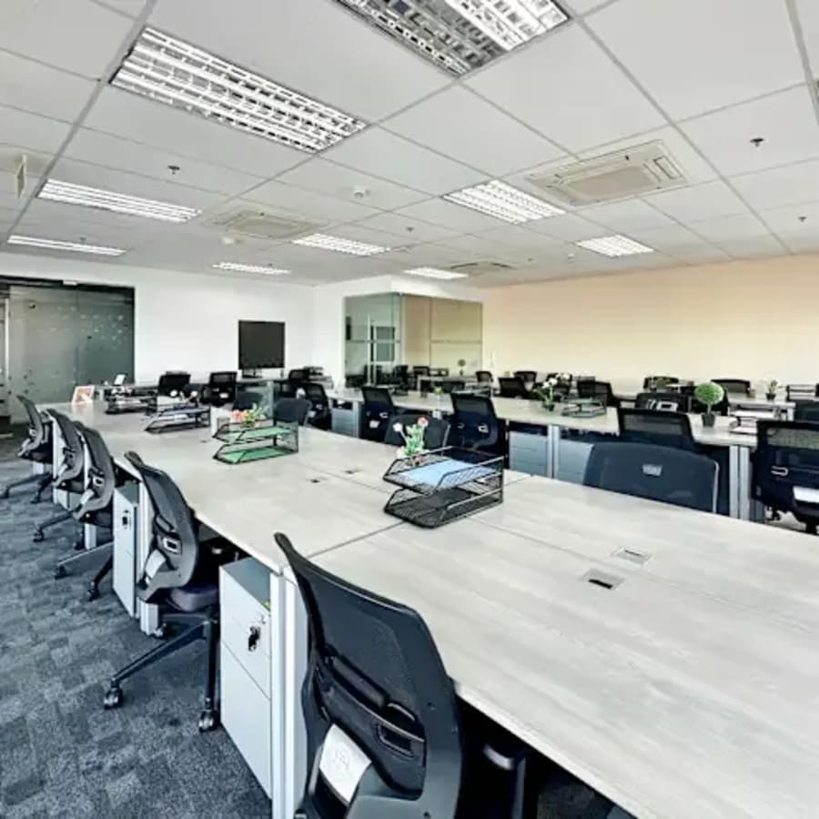 Modern coworking space in Fort Bonifacio with spacious desks and ergonomic chairs.
