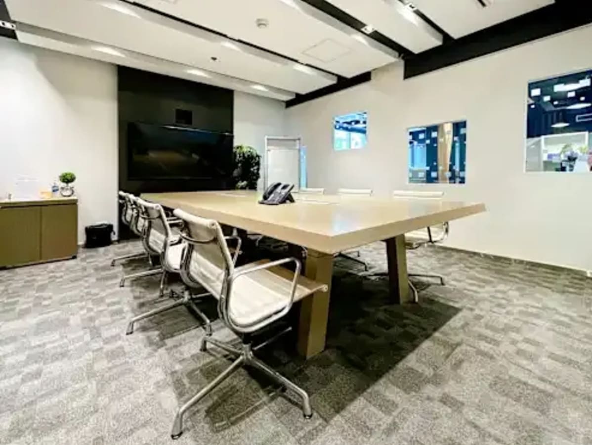 Modern conference room with sleek seating and advanced AV setup in Fort Bonifacio coworking space.