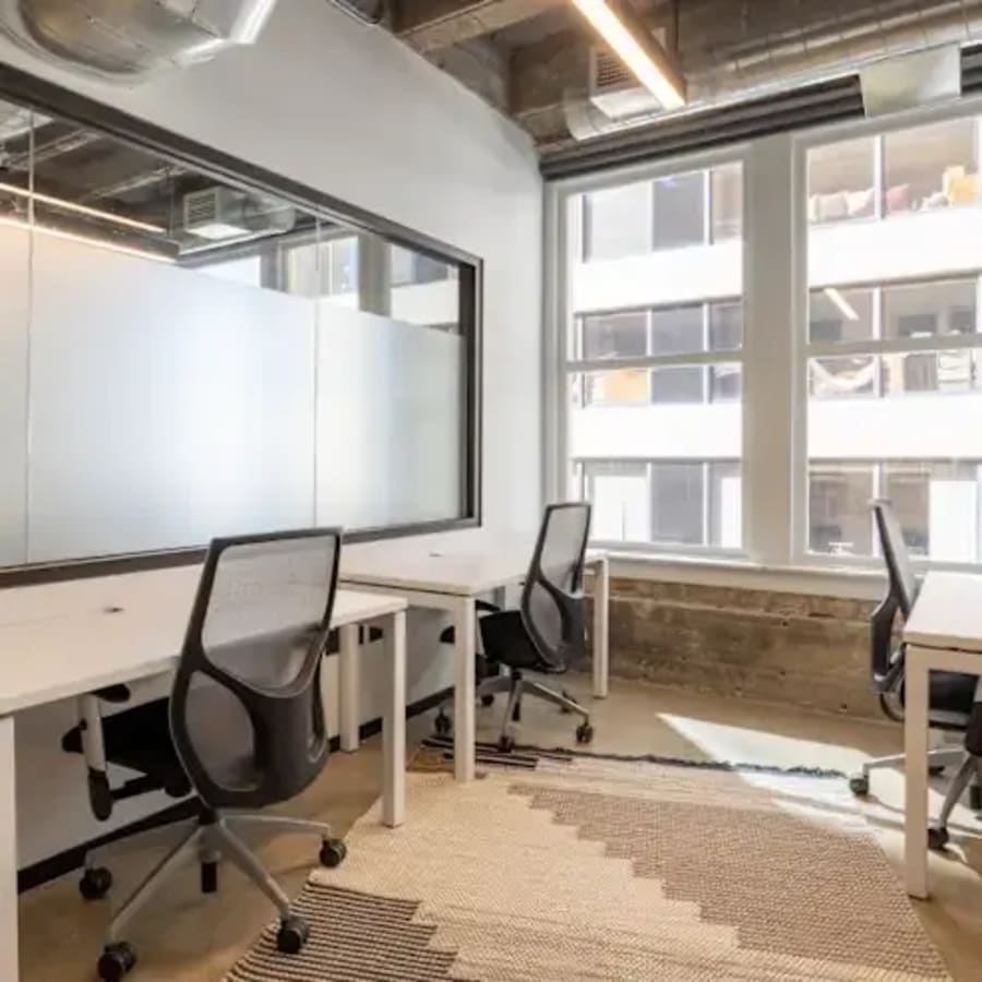 Modern coworking space with natural light, sleek furnishings, and collaborative layout in Taguig.