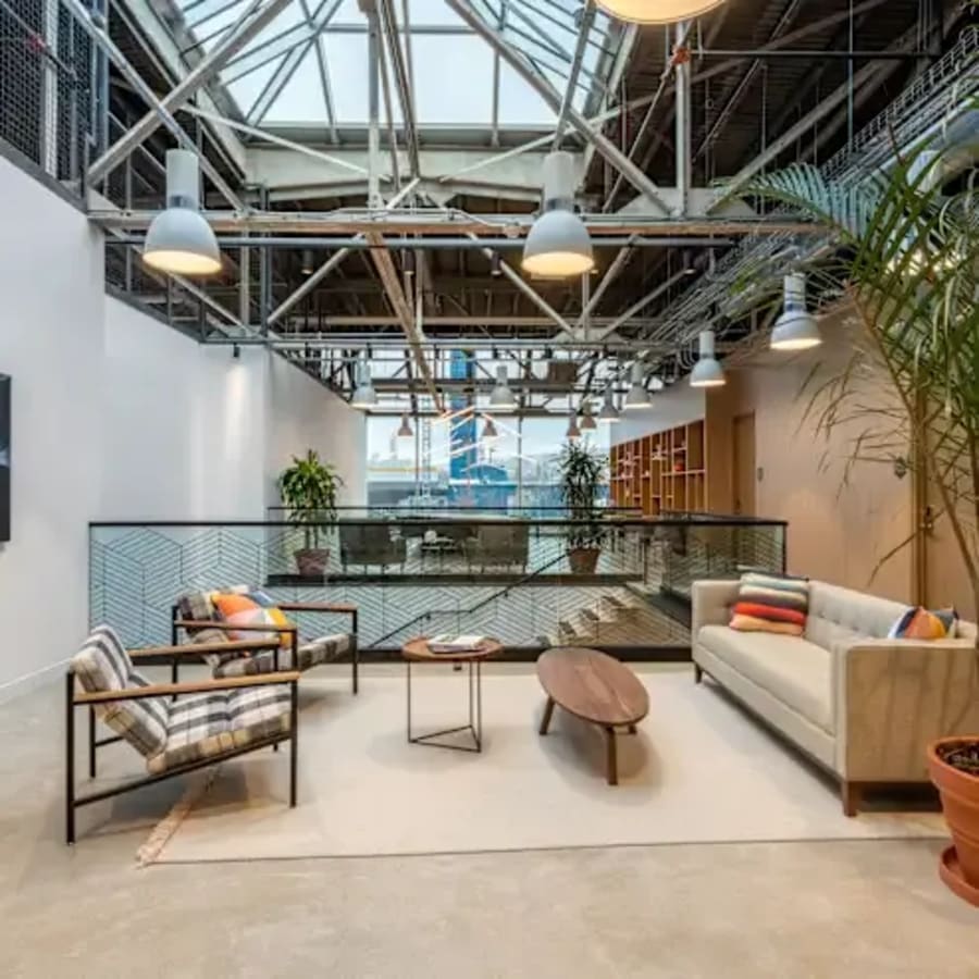 Bright, airy coworking space with modern seating and plenty of natural light. Ideal for collaboration.