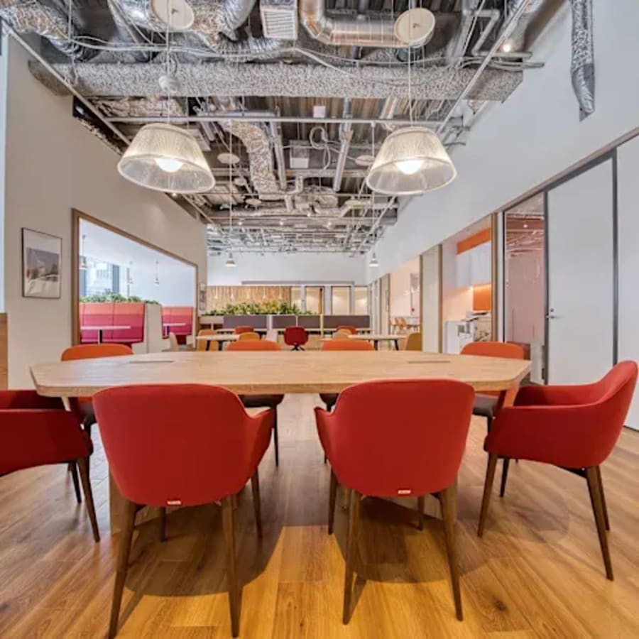 Modern coworking space with vibrant seating, open layout, and natural light in Western Bicutan.