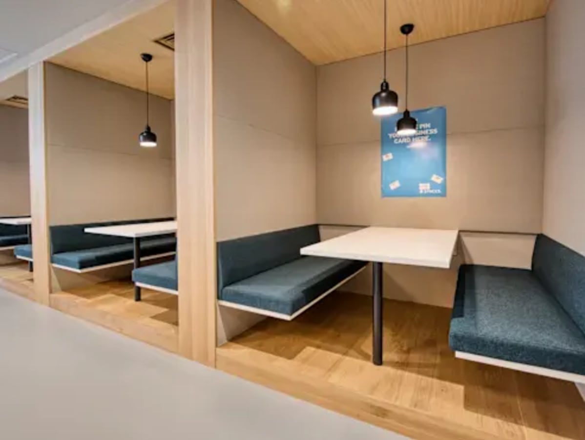 Cozy booths with modern lighting offer a perfect setting for collaboration in Taguig coworking space.