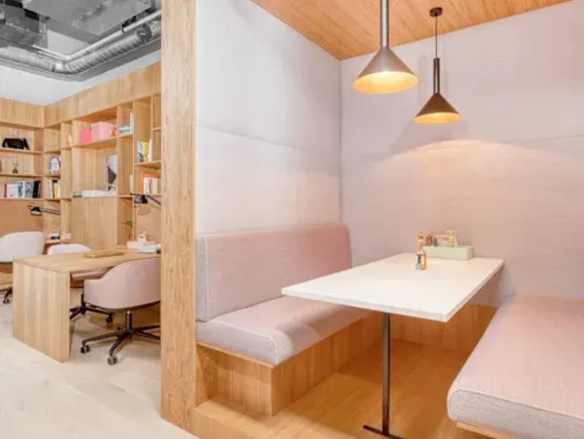 Modern coworking nook with cozy seating, stylish lighting, and functional workspaces in Taguig.