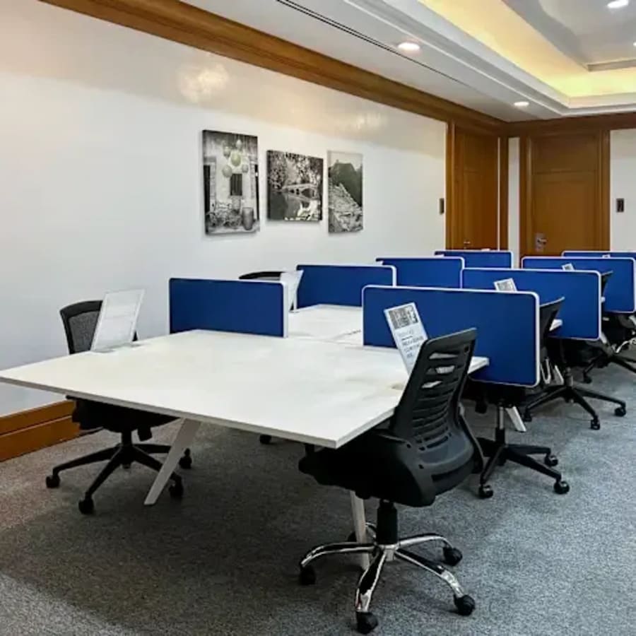 Modern coworking space in Makati featuring ergonomic chairs and individual workstations.