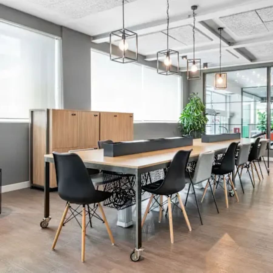 Modern coworking space with ample natural light and sleek, stylish furnishings in Makati.