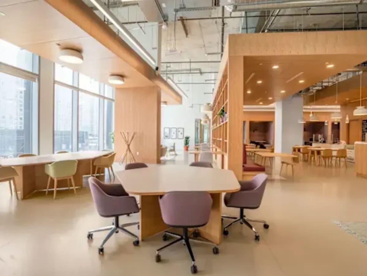 Modern coworking space with open layout, natural light, and stylish furnishings in Taguig.