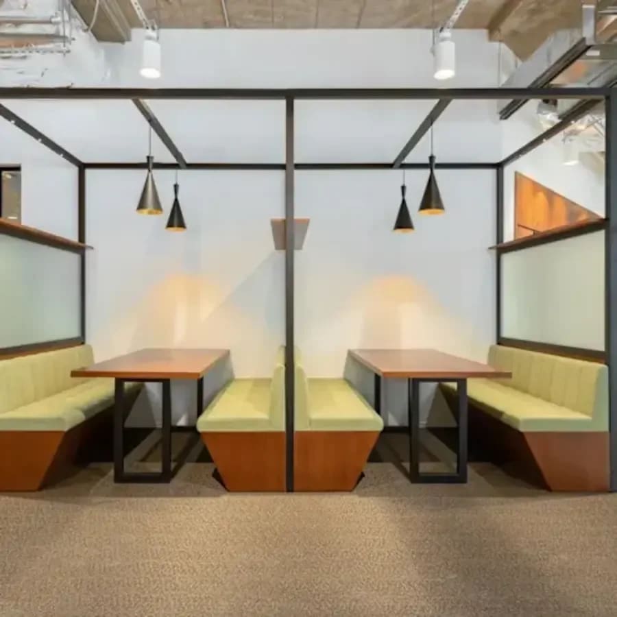 Modern coworking space with cozy booth seating and stylish lighting in Taguig.