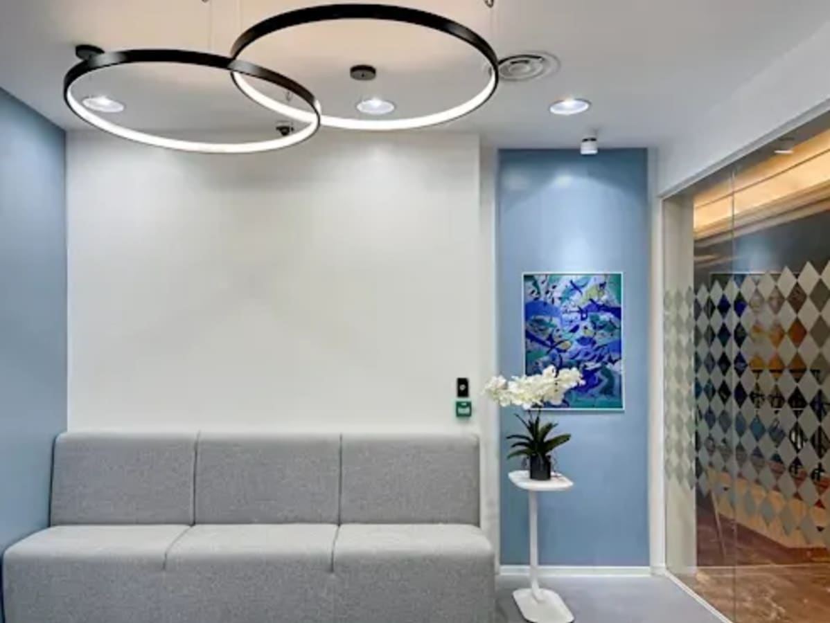 Modern coworking space with stylish seating, artistic decor, and sleek lighting on Gen. Malvar Street.