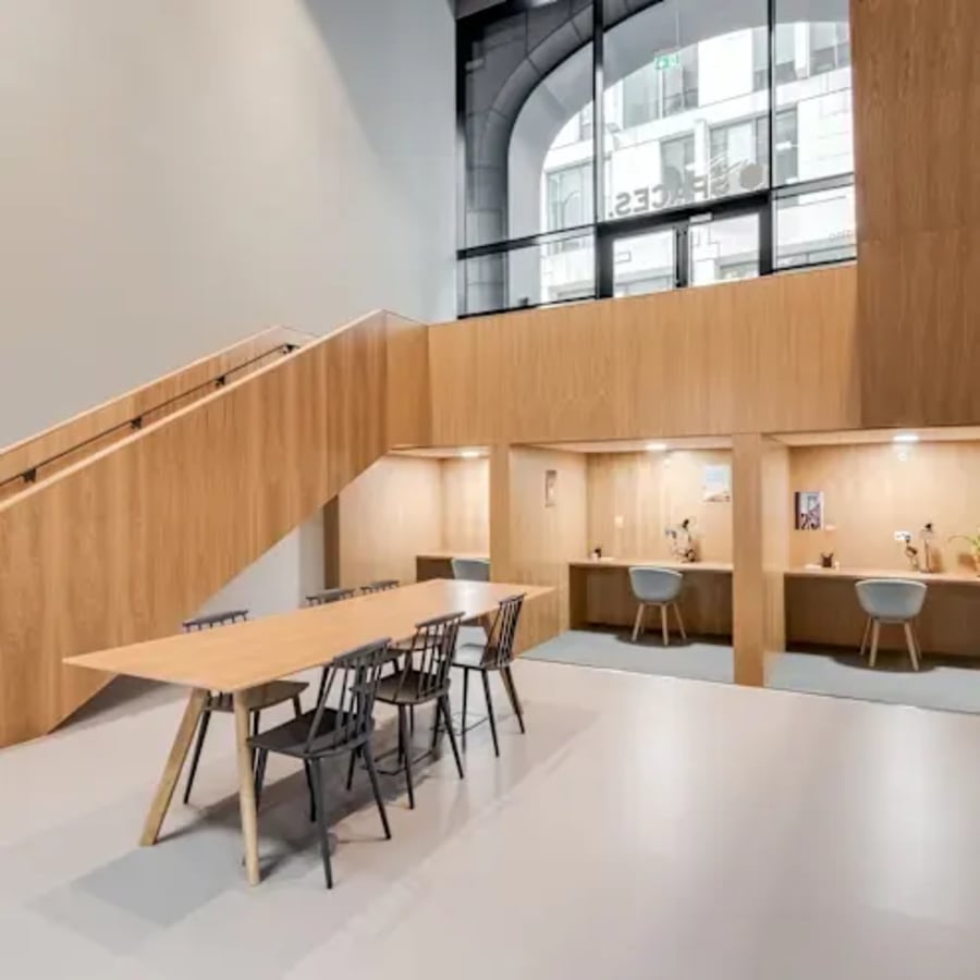 Modern coworking space with natural light, sleek wooden finishes, and open seating on Abanao Street.