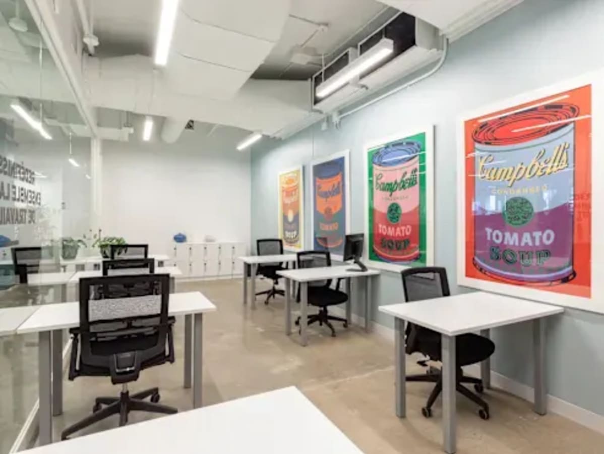 Bright coworking space with modern desks and iconic decor on EDSA, Metro Manila.