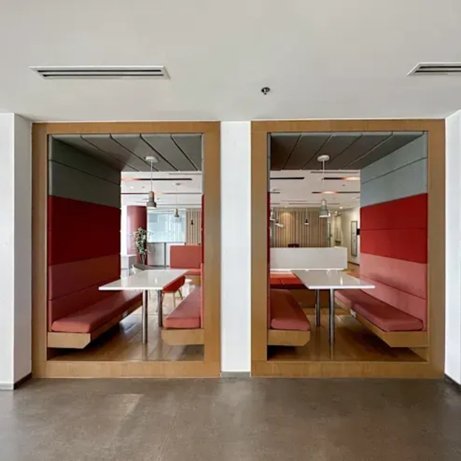 Modern coworking pods with vibrant seating on Ayala Avenue, ideal for collaborative work.