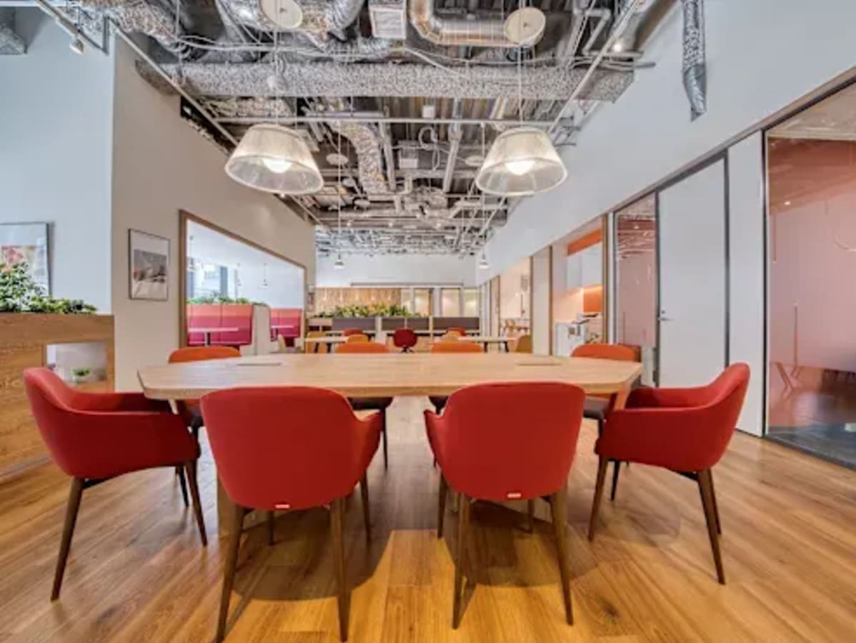 Modern coworking space in Raipur with vibrant seating, open layout, and ample natural light.