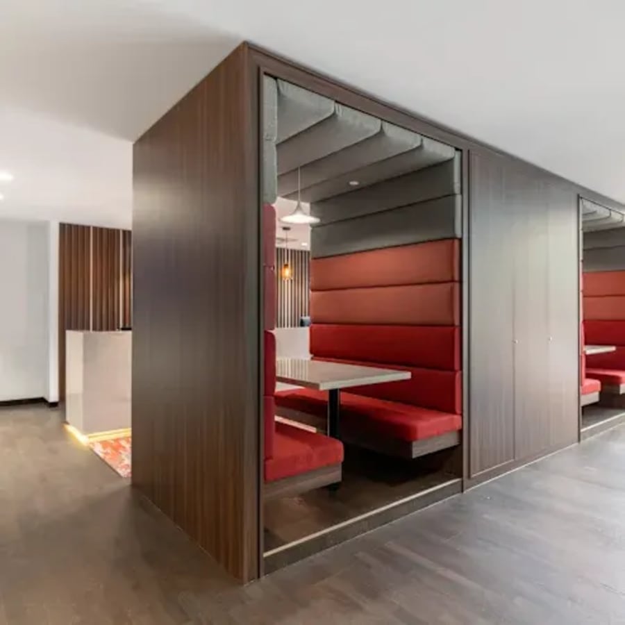 Modern coworking booths with plush seating in Kondapur. Ideal for focused work and collaboration.