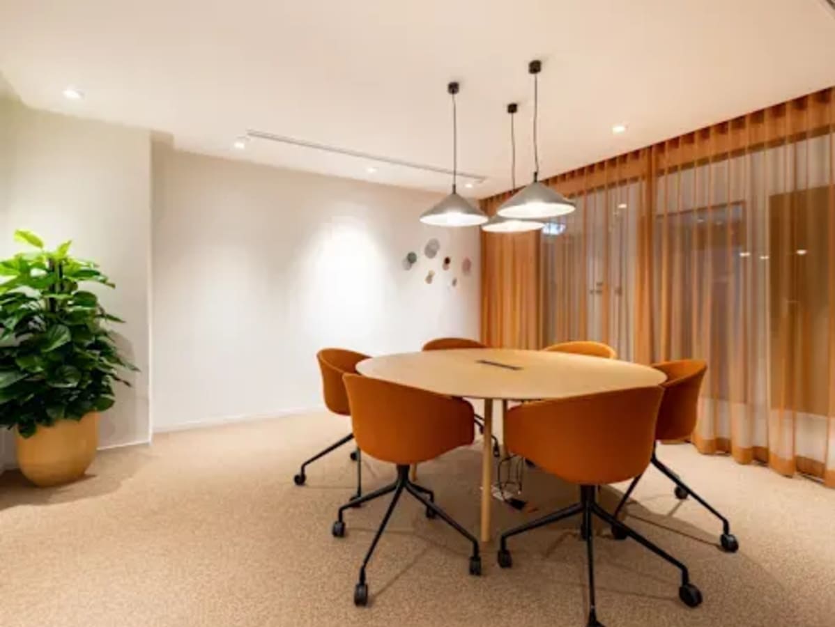 Modern coworking space with stylish seating, natural light, and inviting decor on Infopark Road.