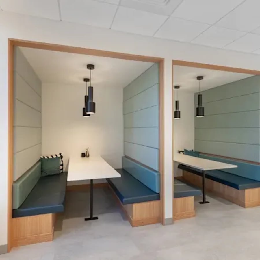 Cozy booth seating with modern lighting, perfect for collaborative work at Harbourfront Place.