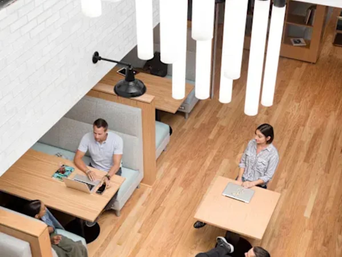 Modern coworking space in Hyderabad with collaborative seating and stylish lighting.