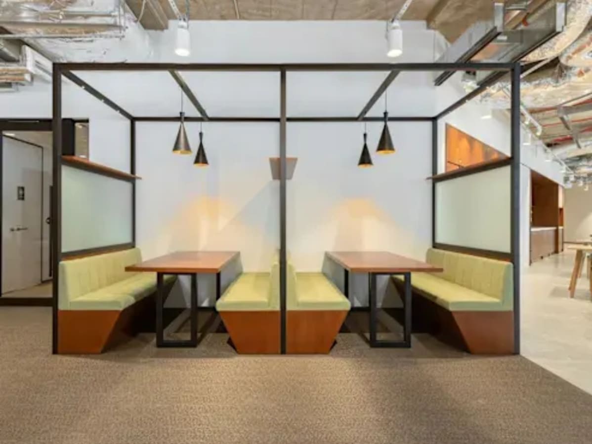 Modern booth seating in a flexible Harbourfront coworking space, perfect for casual meetings.