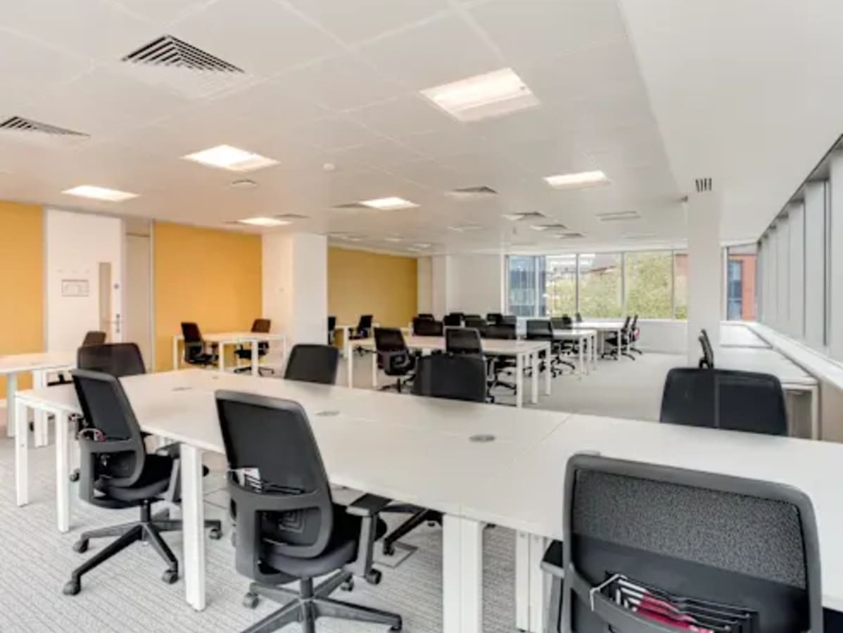 Modern coworking space with ample natural light and ergonomic seating on JNTU Road.